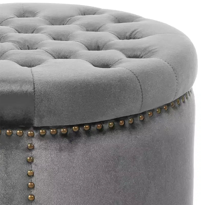 Pouf rond capitonné en velours avec clous de tapissier